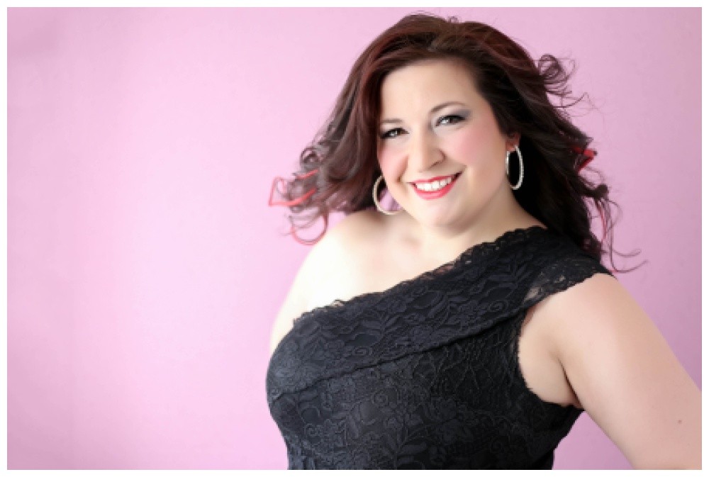 Boudoir photo of a woman on a pink background