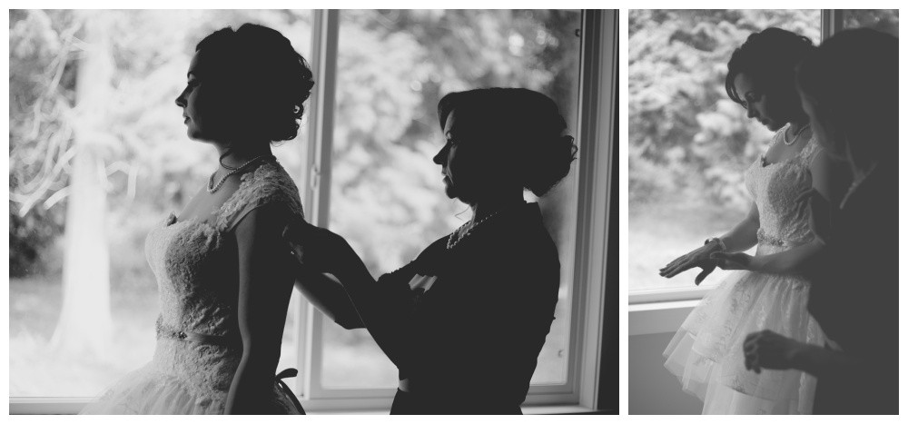 Mother of the bride helps fix the brides gown