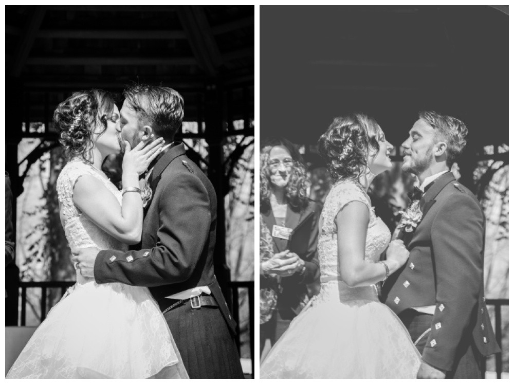 Bride and groom have their first kiss. 