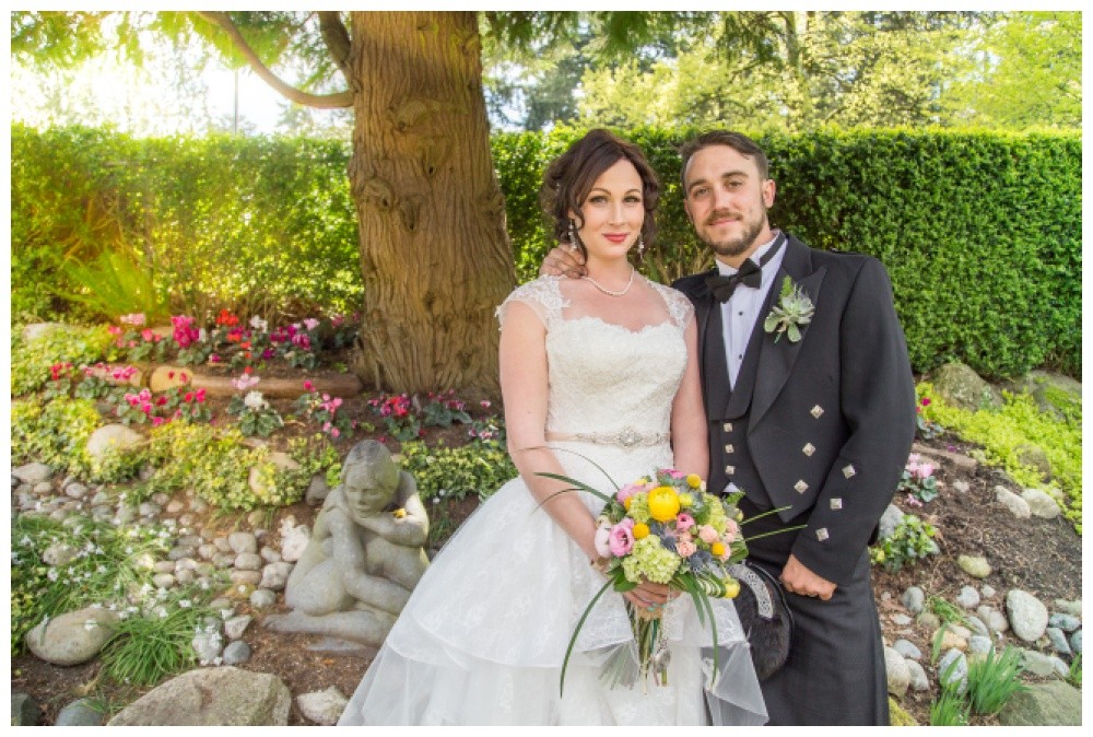 Bride and groom in the Rose garden at Queens Park 