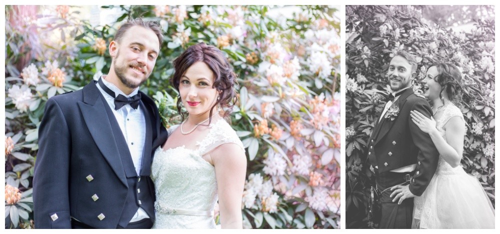 Bride and groom with a flowery backdrop at their Queens Park wedding 