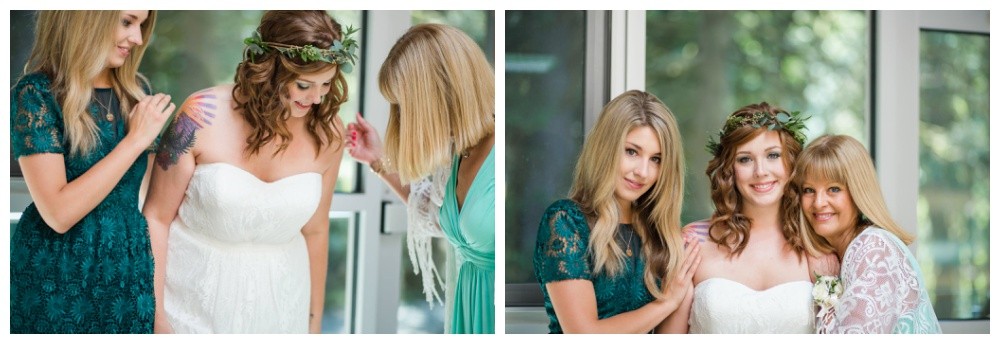 Bride getting ready for her wedding with mom and sister