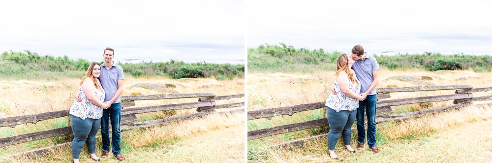 Couple standing by a fence during their vancouver island engagement session