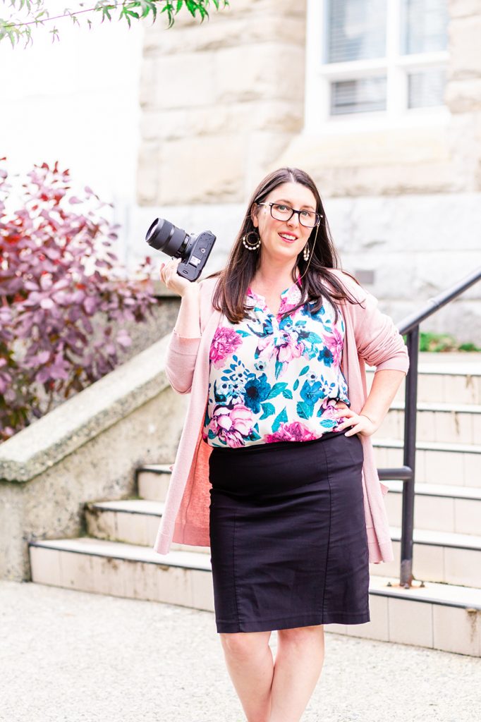 Vancouver Island Wedding Photographer Meaghan Harvey poses with her camera